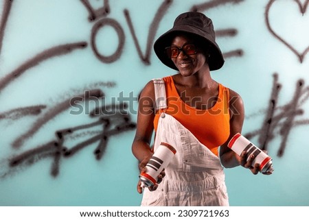 portrait young african american girl in hip hop style, background made by young artist painting with spray cans