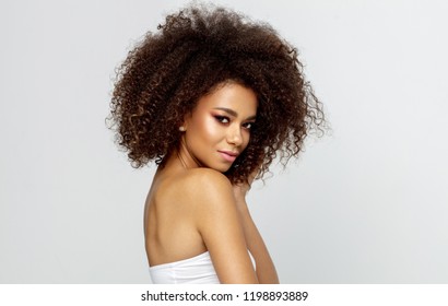Portrait of young african american woman looking at camera isolated on white background