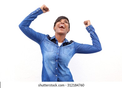 Portrait Of A Young African American Woman Cheering With Arms Raised