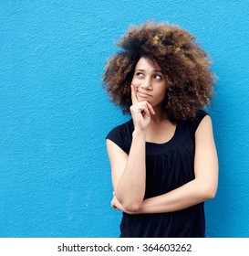 Portrait Of Young African American Woman With Afro Thinking