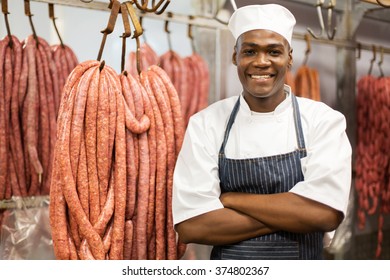 portrait of young african butcher arms crossed in storage - Powered by Shutterstock