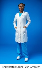 Portrait Of Young African Female Doctor In Blue Studio