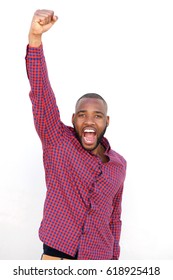 Portrait Of Young African Man With Raised Fist On White Background.