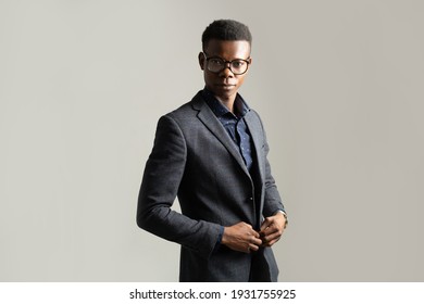 Portrait Of Young African Man In Suit With Glasses 