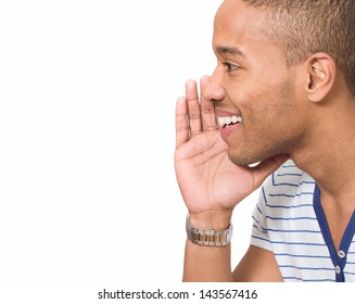 Portrait Of Young African Man Whispering Over White Background