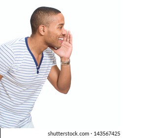 Portrait Of Young African Man Whispering Over White Background