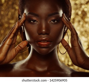 Portrait of Young African model with a beautiful makeup in studio
