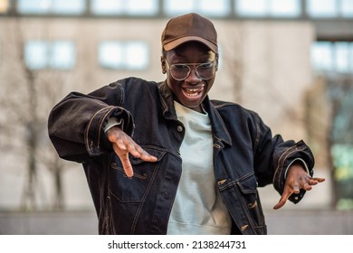 portrait of a young african woman dancing hip hop style, detail of the motion, generation z lifestyle - Shutterstock ID 2138244731