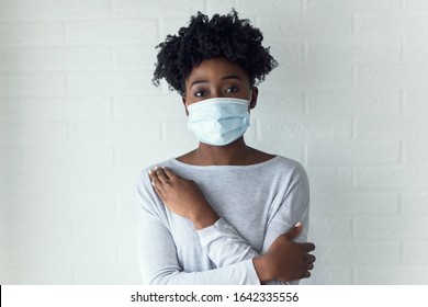 Portrait Of Young African-American Woman Wearing Disposable Medical Face Mask