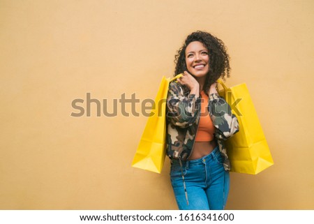 Similar – Yellow shopping bags on a blue background, Shopping concept