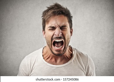 portrait of young angry man - Shutterstock ID 157245086