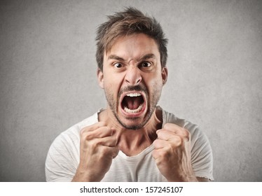 portrait of young angry man - Shutterstock ID 157245107
