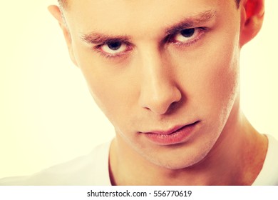 Portrait of young angry man - Shutterstock ID 556770619
