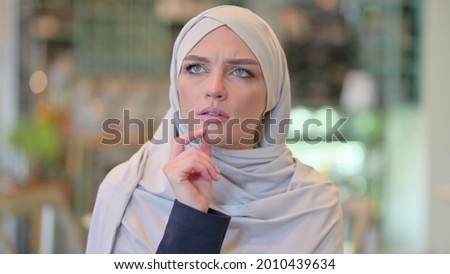 Portrait of Young Arab Woman Thinking about Something 