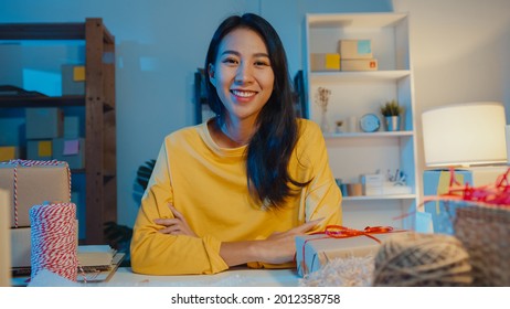 Portrait Of Young Asia Businesswoman Feeling Happy Smile, Arms Crossed And Looking To Camera While Working Store In Home Office At Night. Small Business Owner, Online Market Delivery Concept.