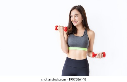 Portrait Of Young Asian Attractive Fitness Woman Holding Dumbbell Studio Shot White Background. Sport Ware Girl Workout With Strong Beautiful Slim Fit Body Shape, Asia Lifestyle Stay Home Concept