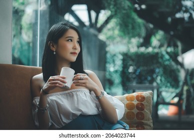 Portrait Of Young Asian Beautiful Cute Girl In Cafe, Lifestyle Concept