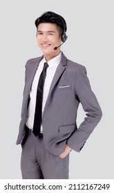 Portrait Young Asian Business Man Call Center Wearing Headset Isolated On White Background, Agent With Support And Service, Businessman Is Assistant For Client With Phone Or Helpline Online.