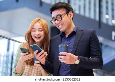 Portrait Of Young Asian Business People At Office