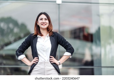 Portrait Of Young Asian Business Woman Smiling Akimbo Outdoor Of Terminal In Airport