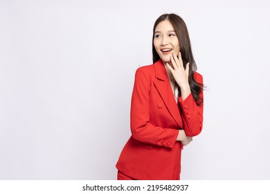Portrait of young Asian businesswoman keeps hand near mouth and whispers secret isolated over white background, Spreads rumors concept - Shutterstock ID 2195482937