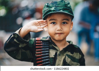 Portrait Of Young Asian Children In Soldier Uniform