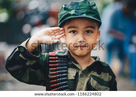 Portrait of young Asian children in Soldier uniform