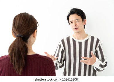 Portrait Of Young Asian Couple Talking