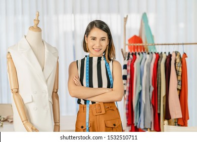 Portrait Young Asian Designer Woman Are Arms Crossed At Workplace Beside Clothes Mannequins, Small Business Startup, Business Owner Entrepreneur, Modern Freelance Job Lifestyle Concept.asean People