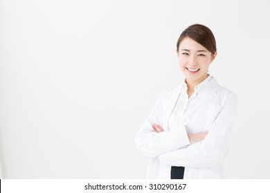 Portrait Of Young Asian Doctor Isolated On White Background