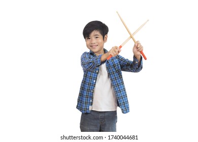 A portrait of a young Asian elementary school student wearing a plaid shirt and a drumstick. An isolated image with white background. - Powered by Shutterstock