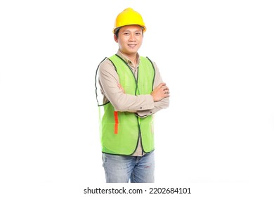 Portrait Of Young Asian Engineer Male Worker In Protective Safety Uniform Helmet Standing Isolated On White Background.