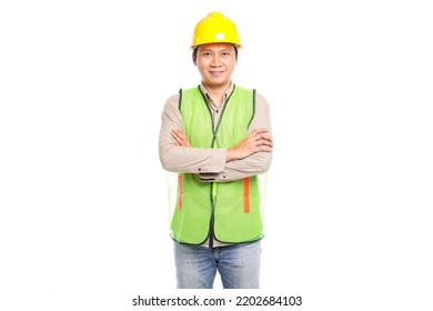 Portrait Of Young Asian Engineer Male Worker In Protective Safety Uniform Helmet Standing Isolated On White Background.