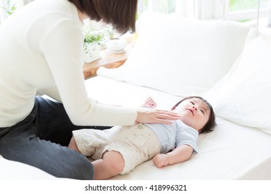 portrait of young asian family relaxing