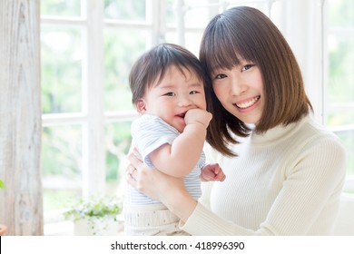 portrait of young asian family relaxing
