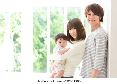 portrait of young asian family relaxing