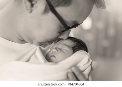 Portrait Of Young Asian Father With His New Born Baby, Copy Space With Bed In The Hospital Background, Sad Die Loser The Baby Father's Day Concept (black And White)