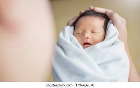 Portrait Of Young Asian Father Or Mother With Healthy Newborn Baby, Copy Space With Bed In Hospital Background. Single Caucasian Dad, Happy Family Healthcare And Father's Day Concept Top View Banner