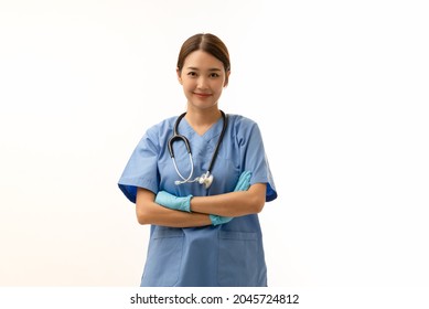 Portrait Of Young Asian Female Doctor Wearing Gloves With Stethoscope Over Neck And Nice Smile, Arms Cross, Isolated On White Background