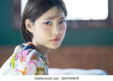 Portrait of a young asian girl. Colorful makeup. Art make up. Cosmetics.