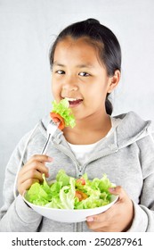 Portrait Young Asian Girl Happy To Eating Salad, Vegetable