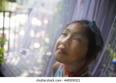 Portrait Of Young Asian Girl, Head And Shoulders, Close-up