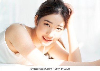 Portrait Of Young Asian Girl Under The Sun
