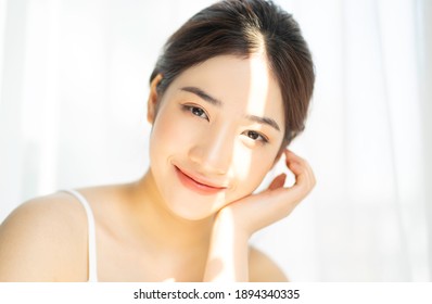 Portrait of young asian girl under the sun

