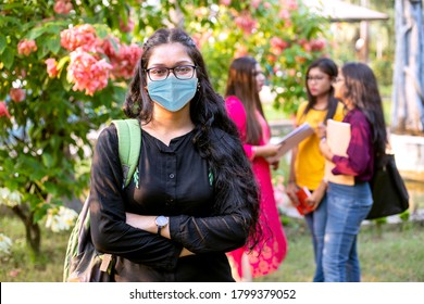 Portrait Of An Young Asian/ Indian Student Wearing Surgical Face Mask And Attending School Or University Classes.