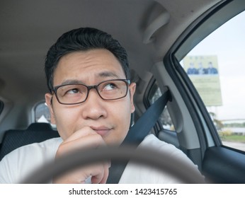 Portrait Of Young Asian Male Driver Thinking Something, Friendly Ride Car Sharing Driver Waiting For Client