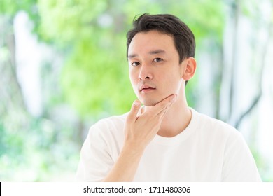 portrait of young asian man beauty image in park