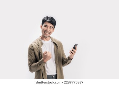 Portrait young Asian man happy cheerful wearing mandarin collar shirt and using smartphone trading or chatting on isolated white background. Successful young man trading in smartphone. - Powered by Shutterstock