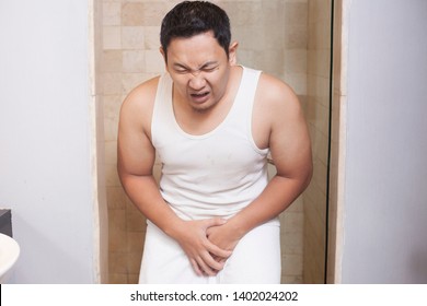 Portrait Of Young Asian Man Having Pain Problem In His Genital Area, Urinary Problem Concept