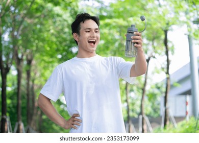 Portrait of young Asian man outside - Powered by Shutterstock